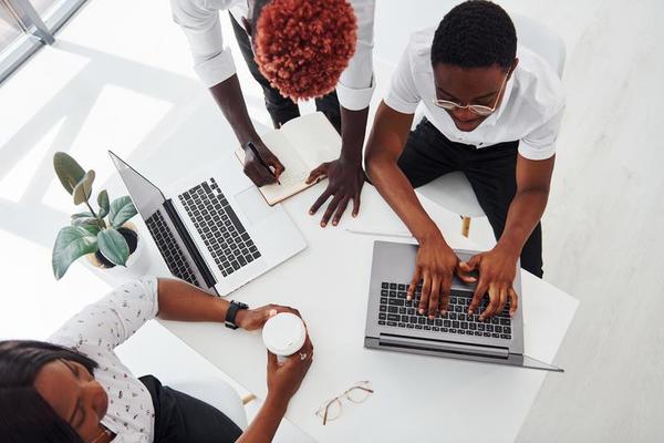 thinking-together-group-of-african-american-business-people-working-in-office-together-free-photo